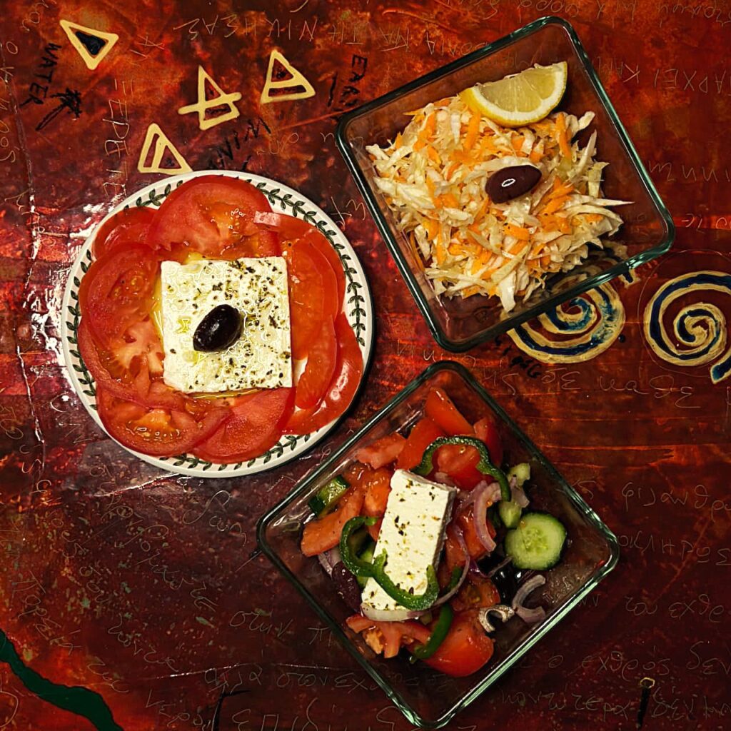 blue-wave-cruises-calypso-salads Fresh Greek salad with local feta cheese, olives, and seasonal greens drizzled with extra virgin olive oil on the Calypso deck table.