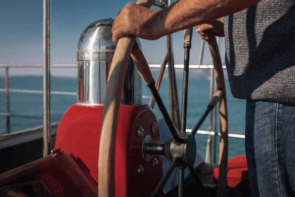 blue_wave_cruises_calypso_07 Captain Alexandros and Panos welcoming guests with a smile and refreshments on the deck of Calypso.