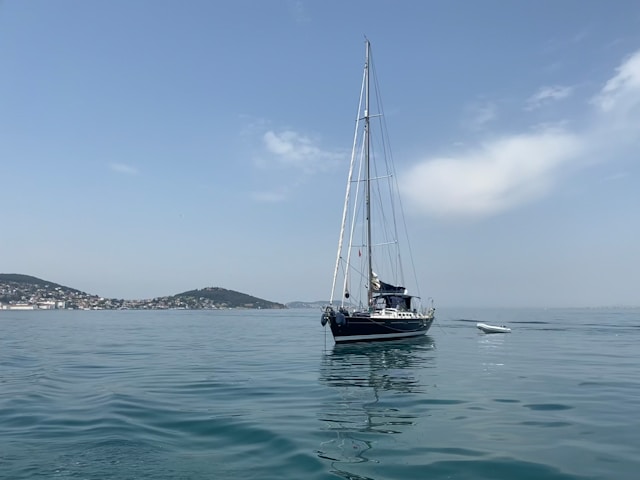 cruising-calm-vibes-mykonos A peaceful view of the Aegean horizon from the shaded lounging area of Calypso boat during a calm morning cruise.